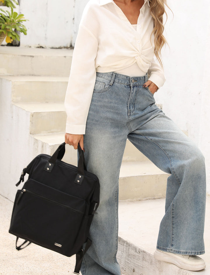 Melbourne Carry All Nappy Bag Backpack - Black Front on Mum 4