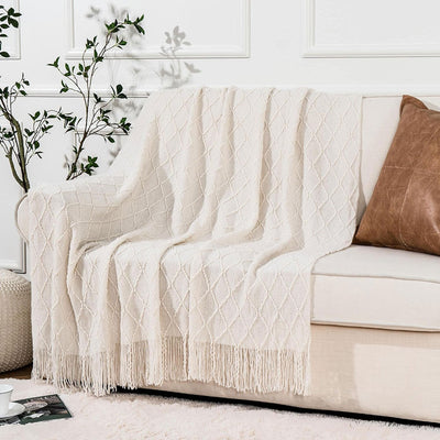 Knit Throw Blanket with Tassels in Cream Color on Sofa. Size 130-150 cm