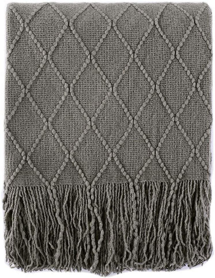 Knit Throw Blanket with Tassels in Grey Color. Folded. Size 130-150 cm