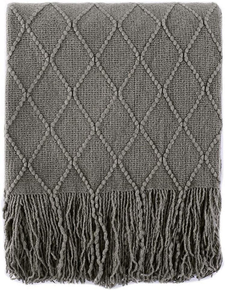 Knit Throw Blanket with Tassels in Grey Color. Folded. Size 130-150 cm