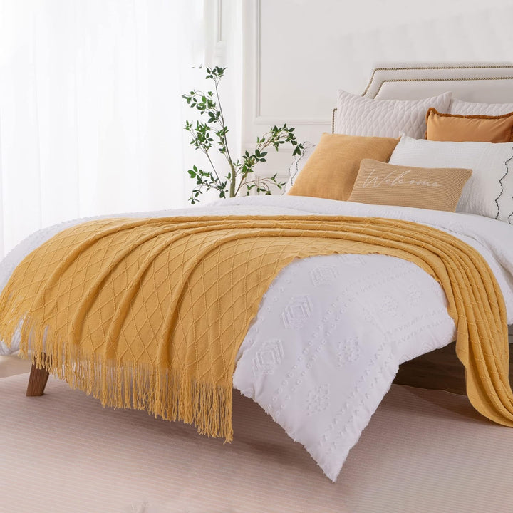 Knit Throw Blanket with Tassels in Mustard Color. On bed 2. Size 130-150 cm