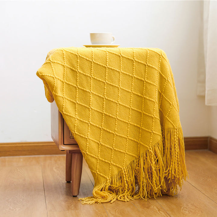 Knit Throw Blanket with Tassels in Mustard Color. On sofa 3. Size 130-150 cm