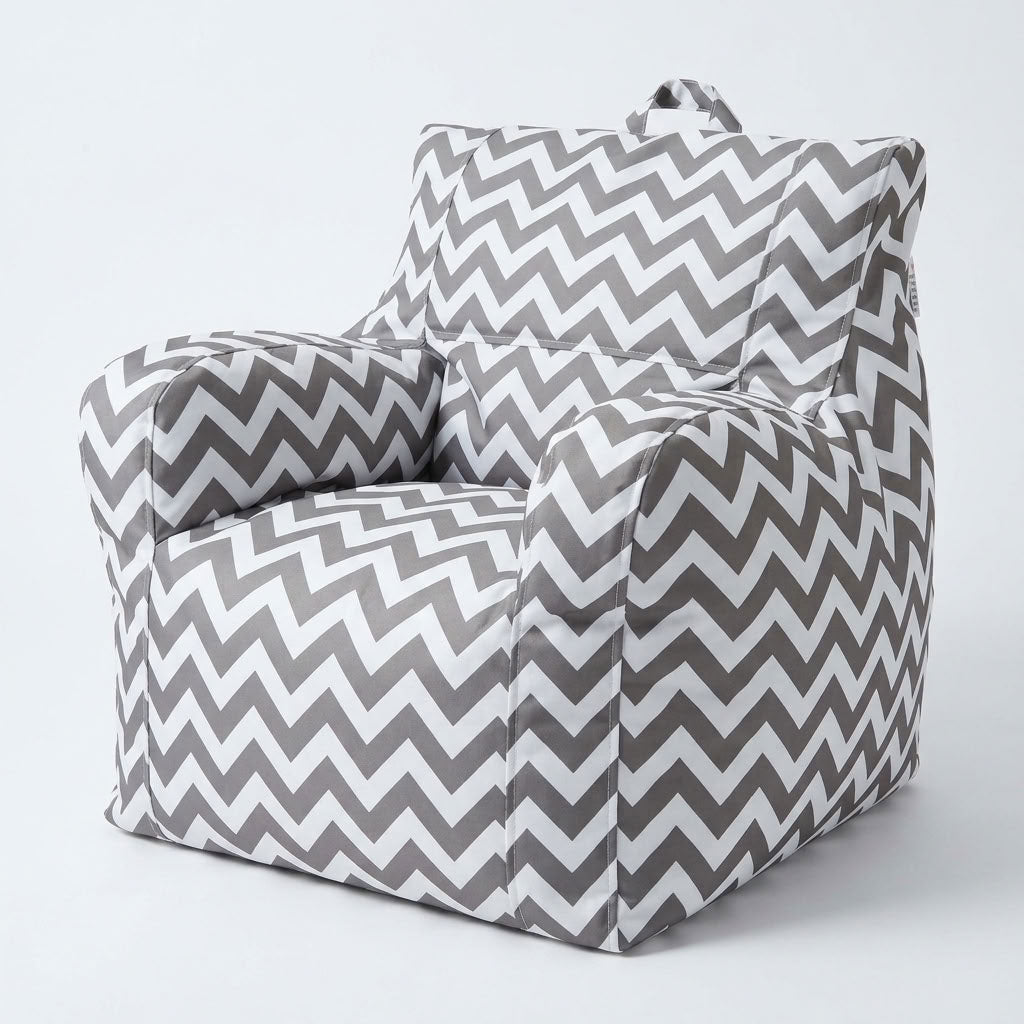 Kora-Chevron-Kids-Bean-Bag-Chair. A soft fabric armchair with a gray and white chevron pattern, photographed on a clean light gray studio background.