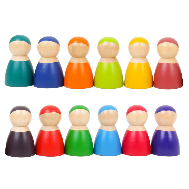 12 Piece Wooden Rainbow Peg Dolls in a row