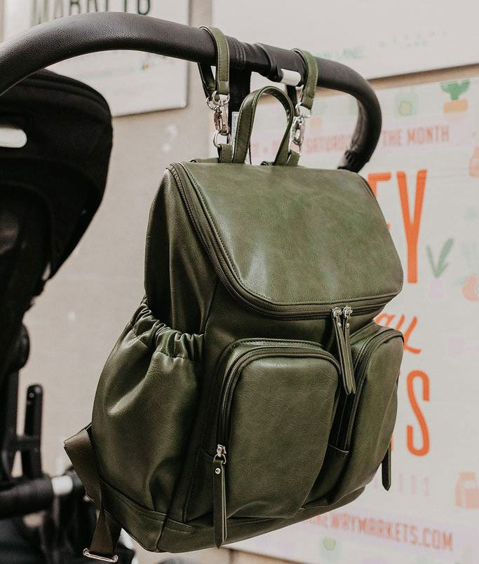 OiOi Olive Green Faux Leather Nappy Bag Backpack on Pram