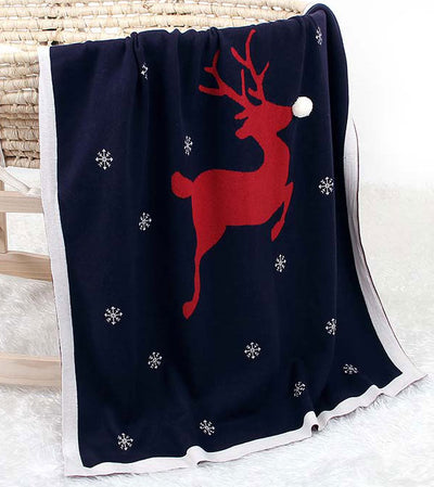 Red Reindeer Baby Blanket in Bassinet